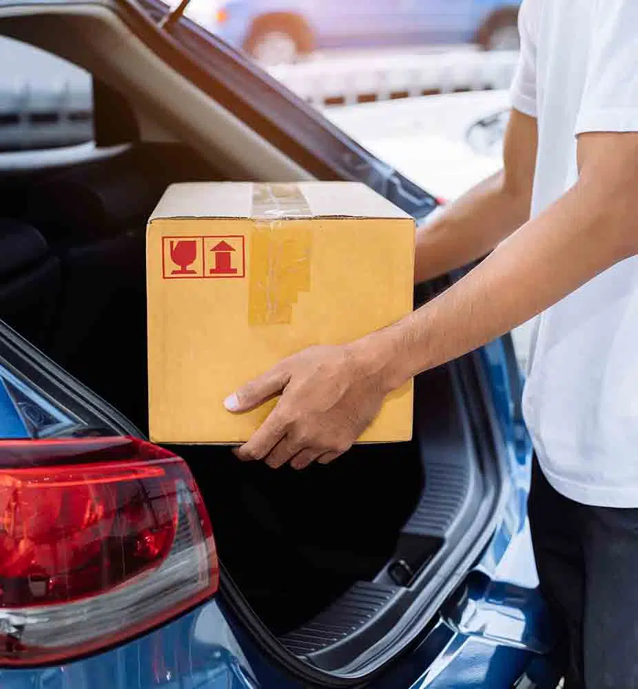 Man Pulling Box Out Of Car