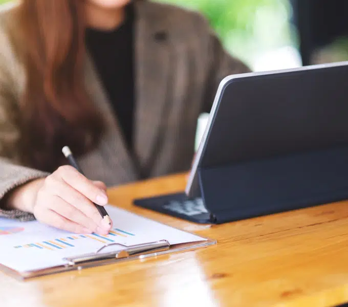 sitting at computer desk reviewing documents