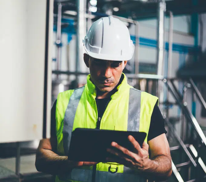 Factory worker using a tablet