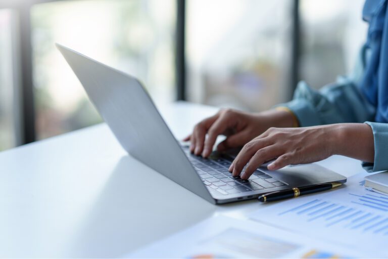 person typing on computer